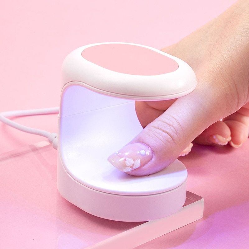 Compact UV LED Nail Dryer Lamp with USB Charging.